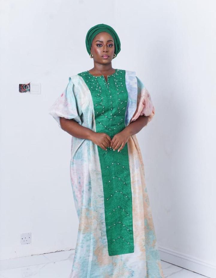 bubu gown styles for church showing a woman wearing a silk worship church bubu gown made by ahdookeh fashion