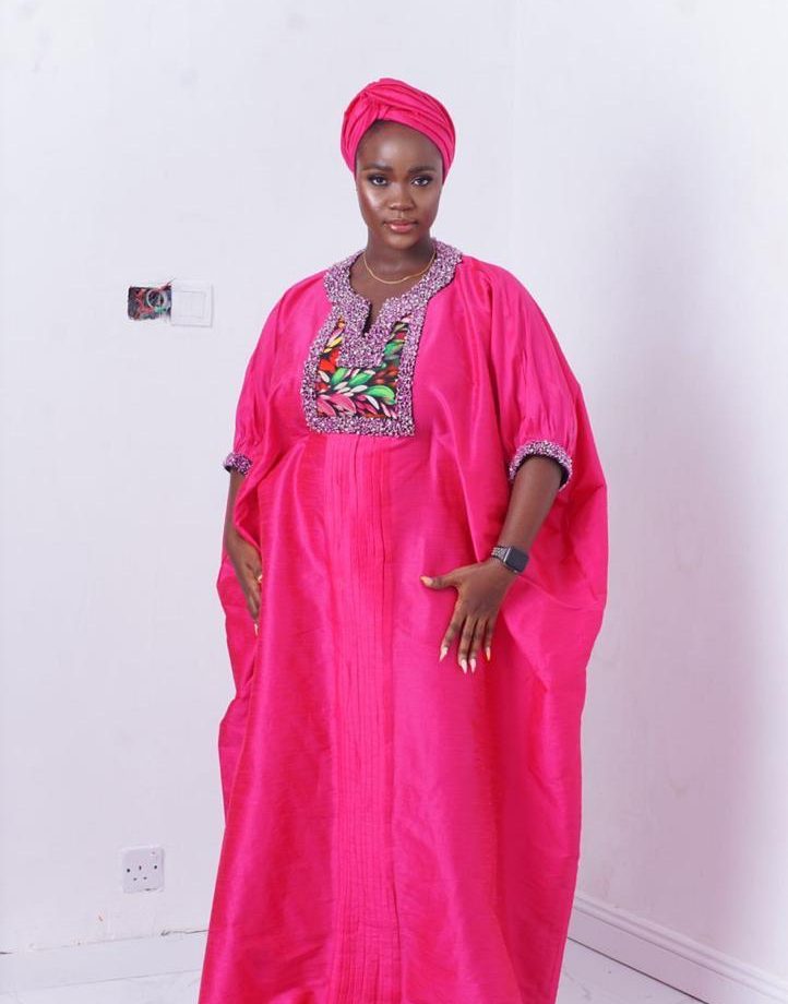 bubu gown styles for owambe showing a picture of a woman wearing a butterfly bubu gown called ashake 2 made by ahdookeh fashion