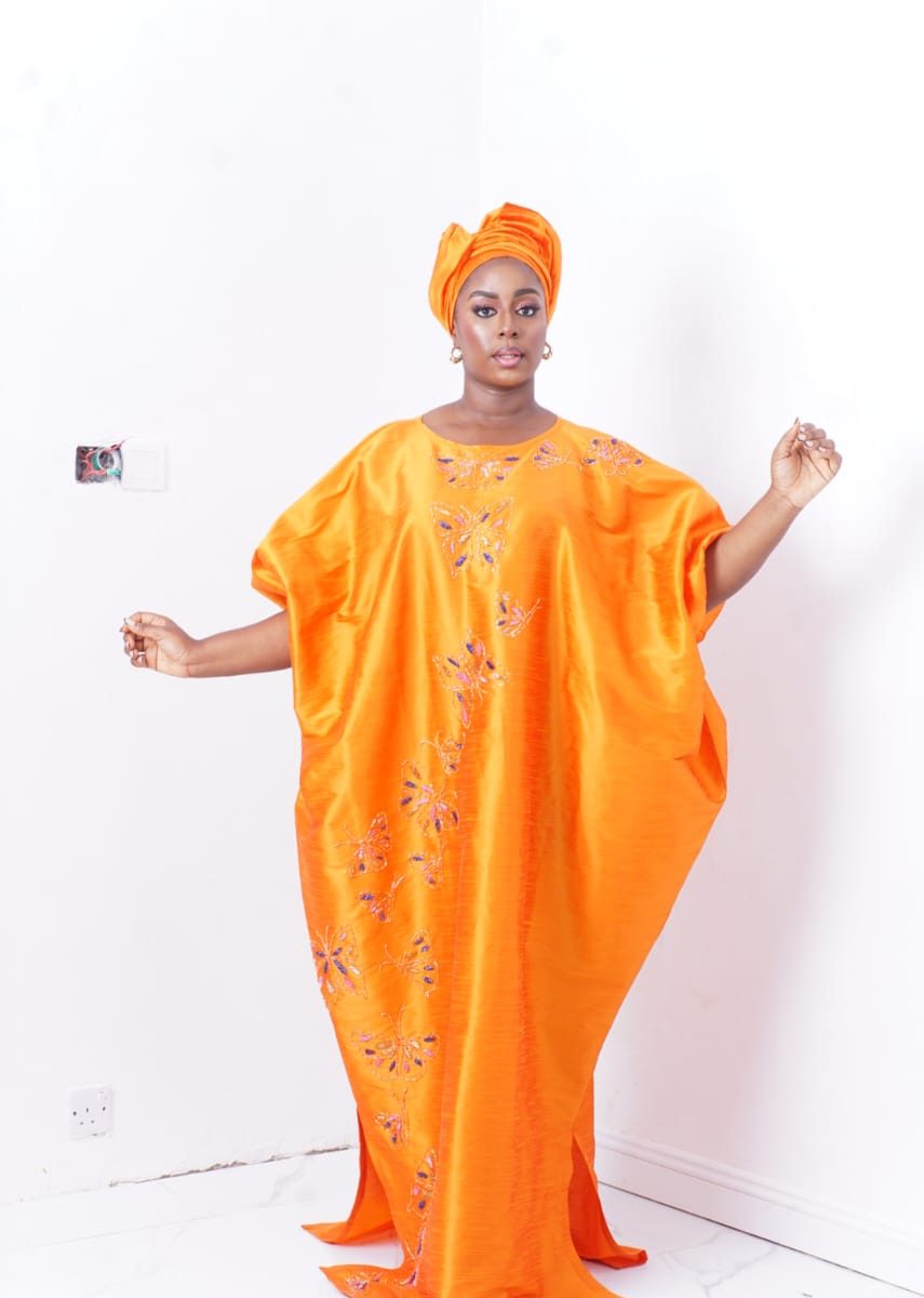 bubu gown styles for wedding showing a woman wearing butterfly bubu gown made by ahdookeh fashion