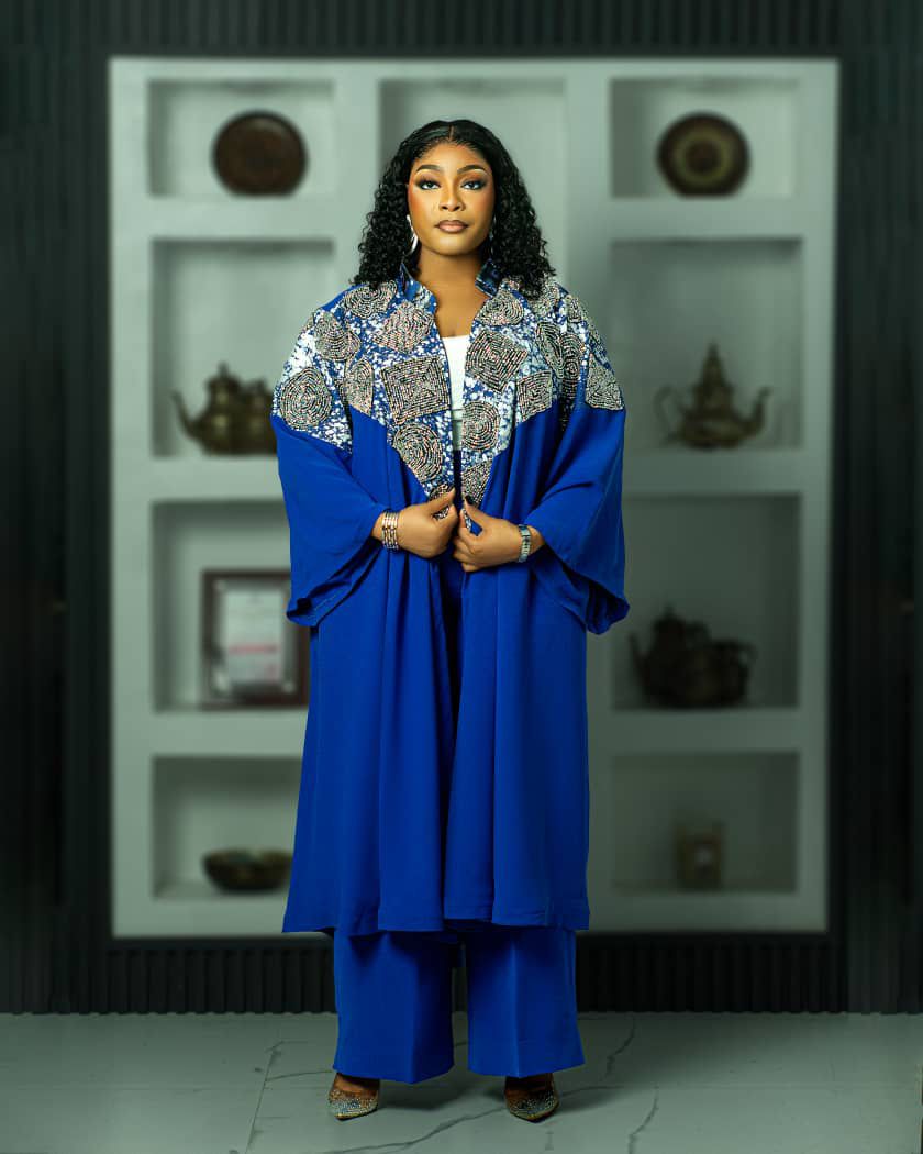 professional two piece styles for ladies showing a woman wearing a royal blue two piece styles made by Ahdookeh Fashion