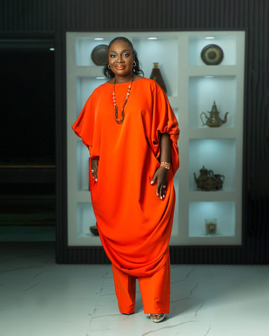 two piece styles for ladies showing a woman wearing a luxury crepe fabric two-piece name Ewa made by Ahdookeh Fashion