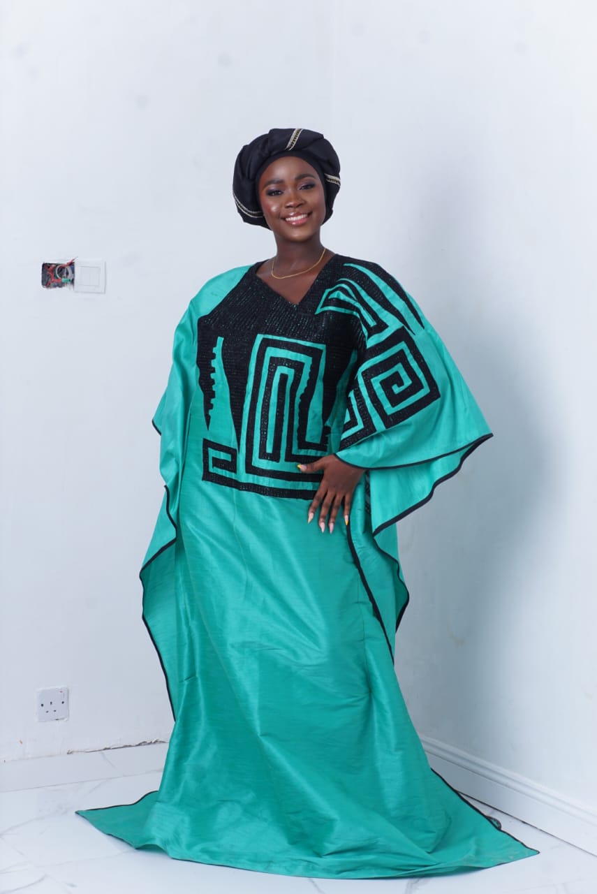 bubu gown styles for church showing a woman wearing church worship bubu gown made by ahdookeh fashion