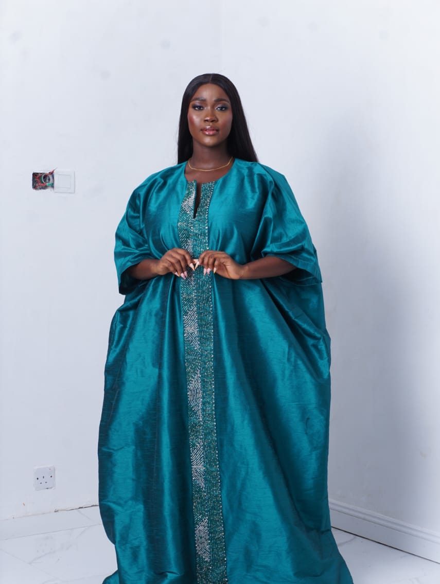 bubu gown styles for owambe showing a picture of a woman wearing kamila bubu gown made by ahdookeh fashion