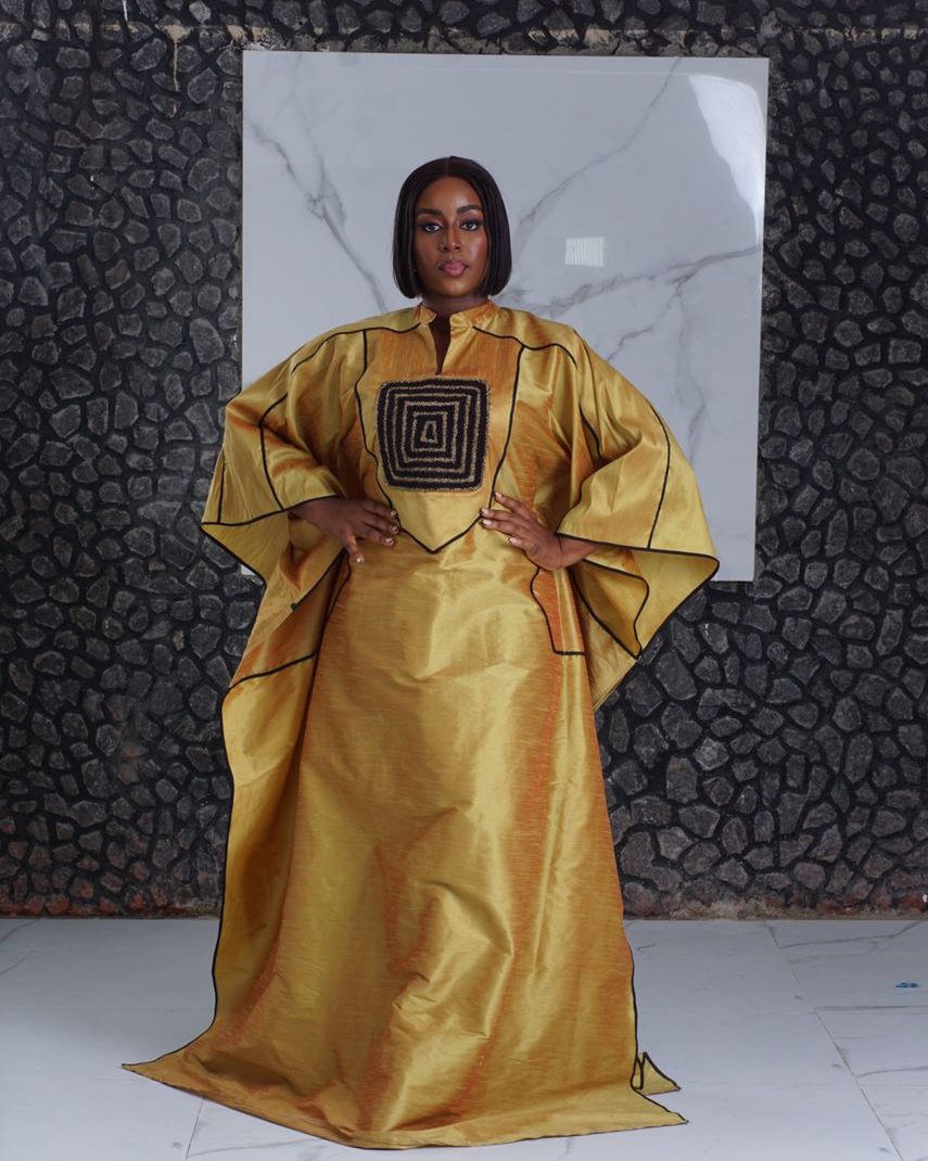 bubu gown styles for naming ceremony showing a woman wearing a naming ceremony bubu gown made by ahdookeh fashion