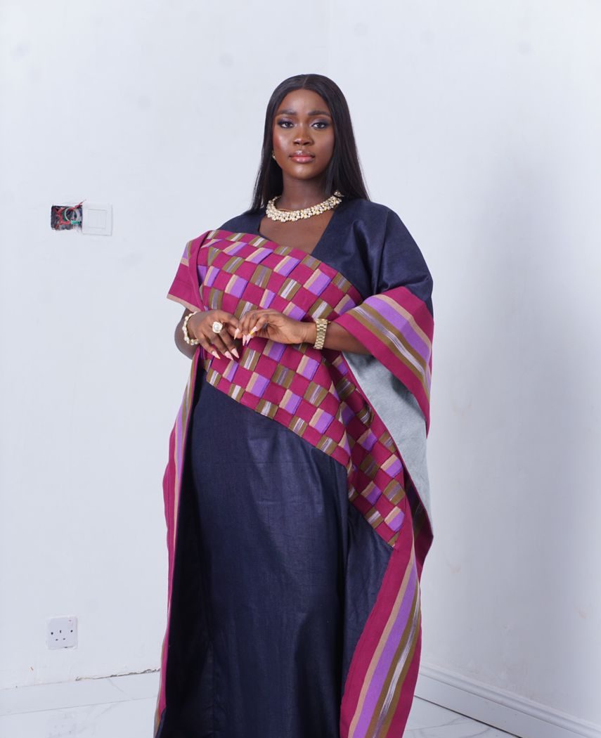 what is aso oke showing a woman wearing denim with agbada aso oke bubu gown made by ahdookeh fashion