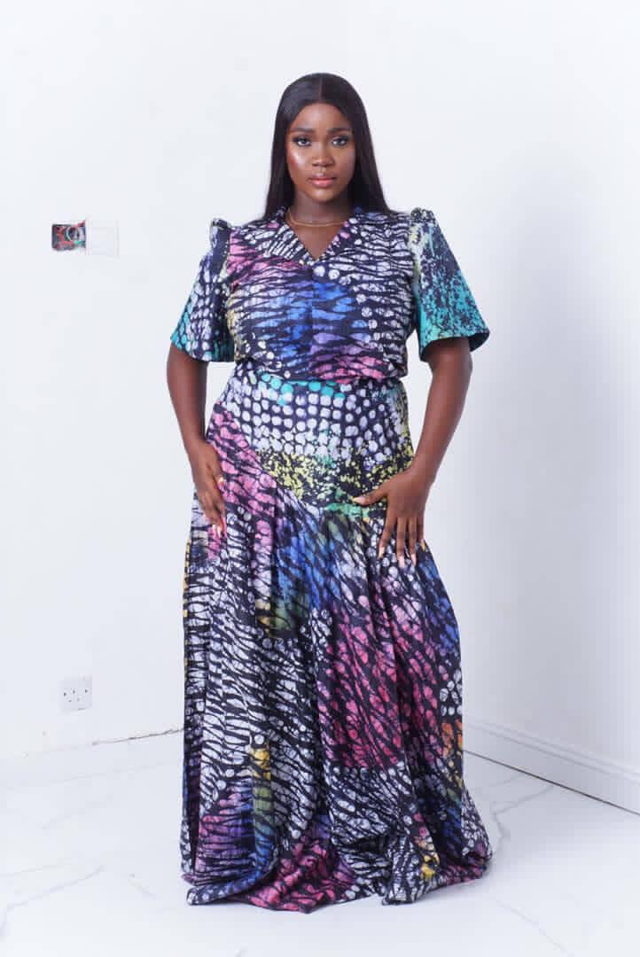 owambe two piece styles for ladies showing a woman wearing adire owambe two piece called Dinma made by Ahdookeh Fashion