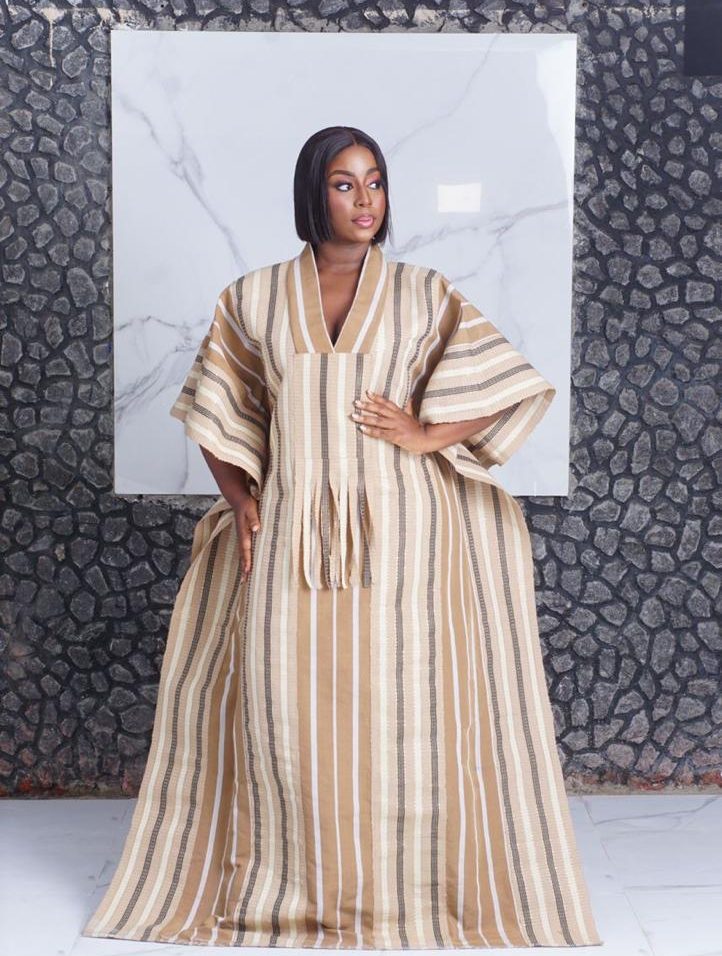 where to buy bubu gowns in lagos showing a woman wearing a bubu gown crafted and made by Ahdookeh Fashion